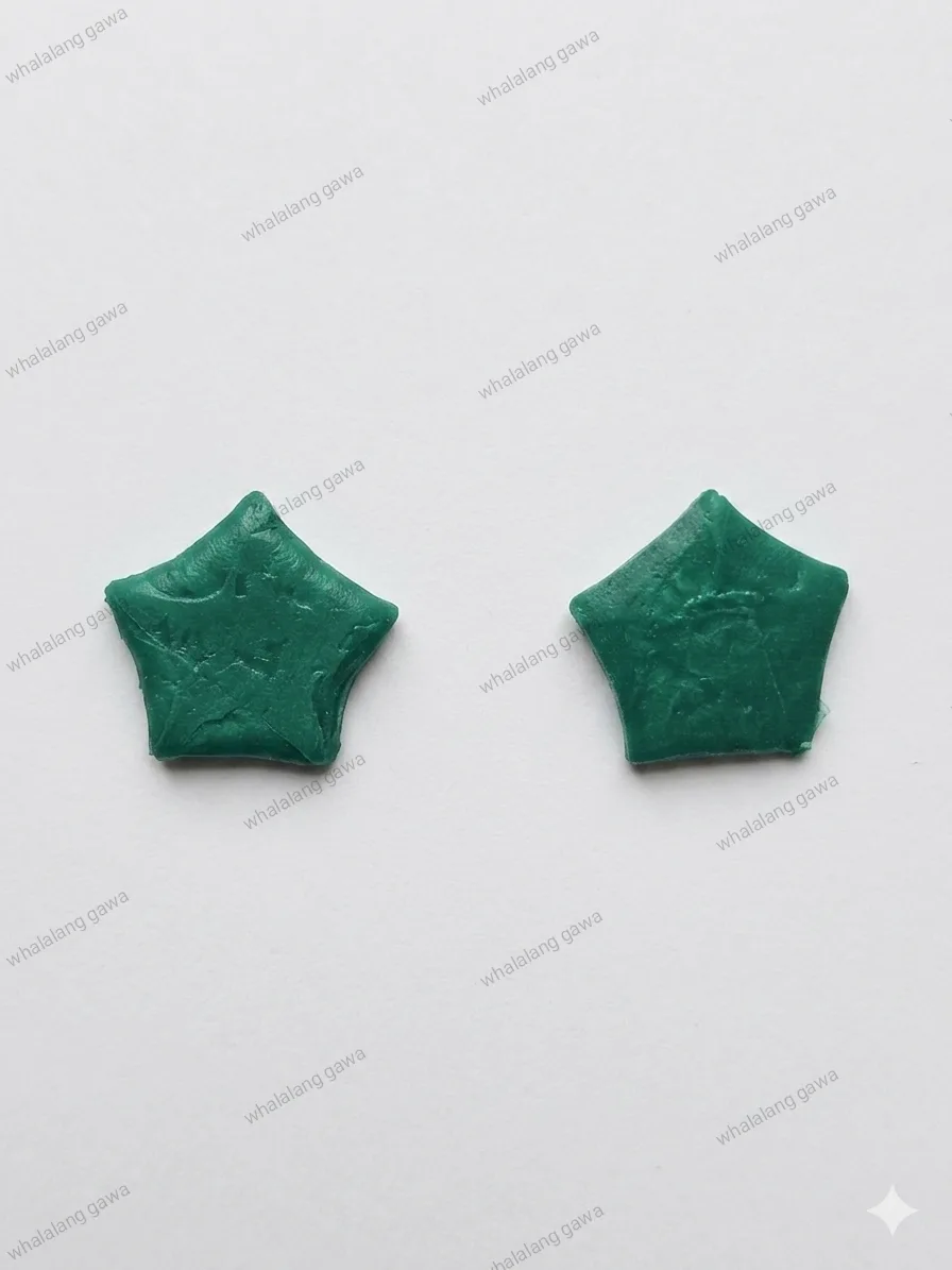 Green upcycled clay pieces before being shaped into earrings