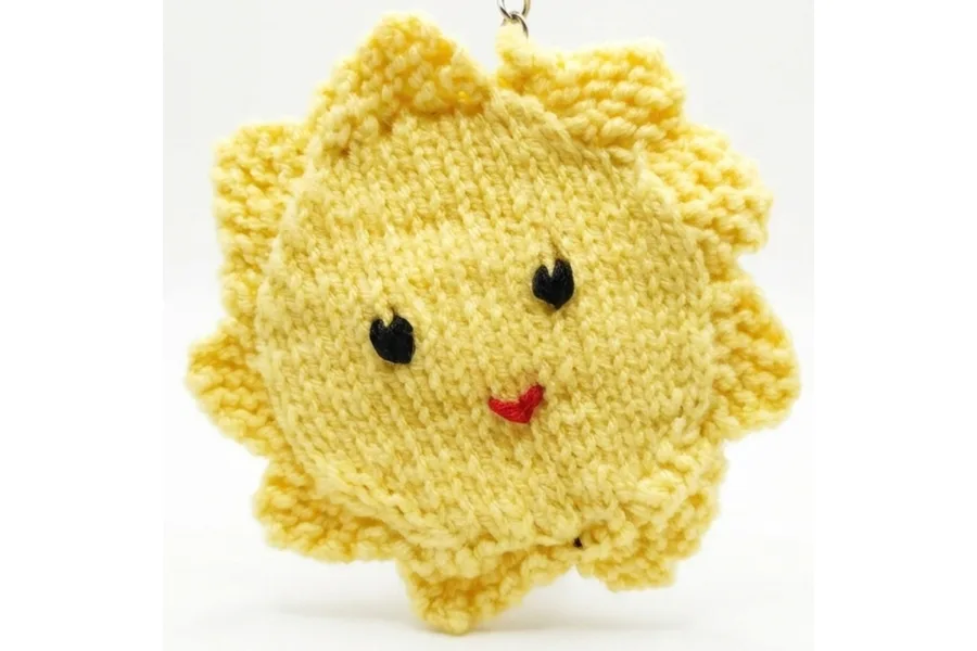 Knitted smiley sun keychain, yellow